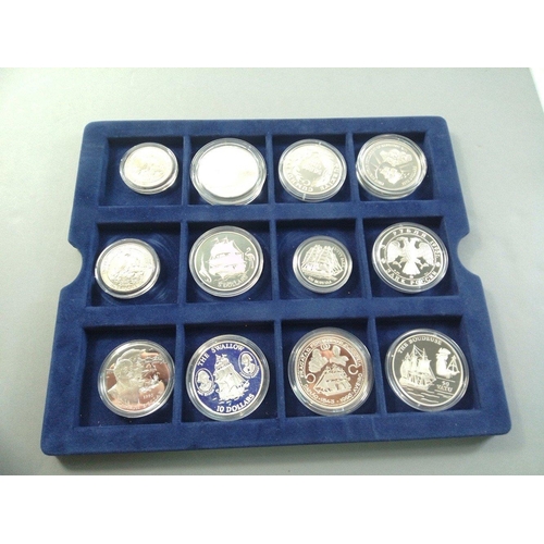 100 - WESTMINSTER MINT coin box containing nineteen encapsulated silver coins from the SHIP'S & EXPLOR... 