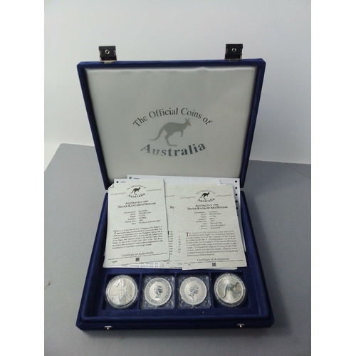 104 - A WESTMINSTER MINT coin case containing four Australian silver Bullion Coins, two Kookaburra's and t... 