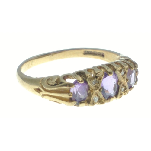 14 - A 375 marked 9ct gold ring with three amethyst coloured stones. Size O. Gross weight 2.6g approx#14... 