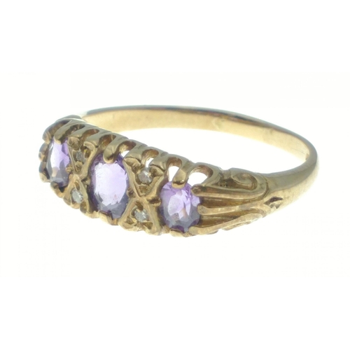 14 - A 375 marked 9ct gold ring with three amethyst coloured stones. Size O. Gross weight 2.6g approx#14... 