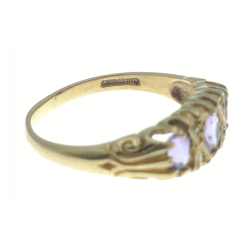 14 - A 375 marked 9ct gold ring with three amethyst coloured stones. Size O. Gross weight 2.6g approx#14... 