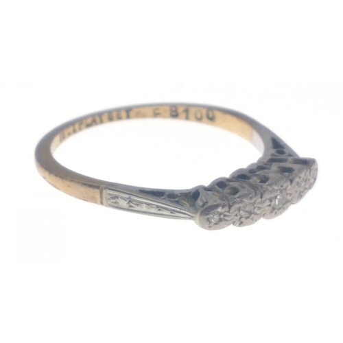 23 - A ring stamped 18ct Plat Set F8100 with five small inset diamonds. Size O, gross weight 2.25g approx... 