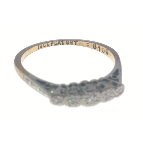 23 - A ring stamped 18ct Plat Set F8100 with five small inset diamonds. Size O, gross weight 2.25g approx... 