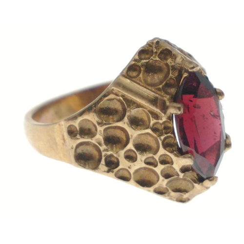 27 - A 9ct gold ring with red navette cut stone. Size L, gross weight 3.4g approx.#27