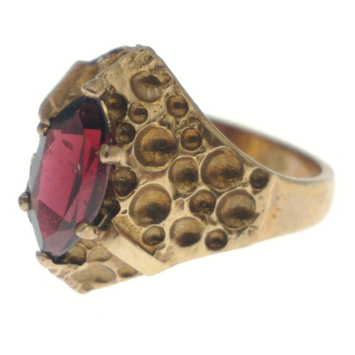 27 - A 9ct gold ring with red navette cut stone. Size L, gross weight 3.4g approx.#27