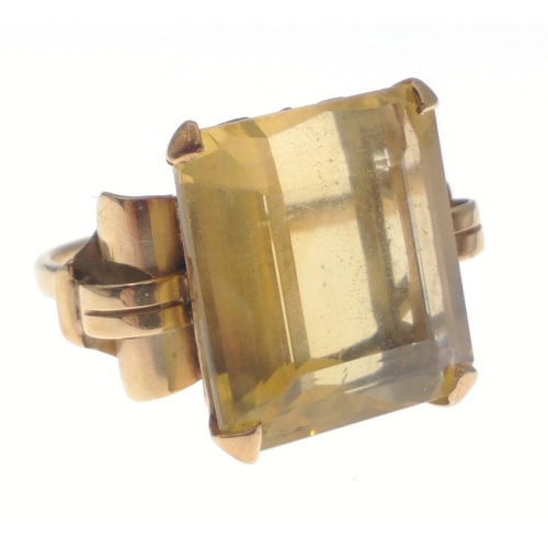 35 - A gold ring stamped 750 set with a large topaz 20 x 20mm approx.  Size O, gross weight 10.65g approx... 