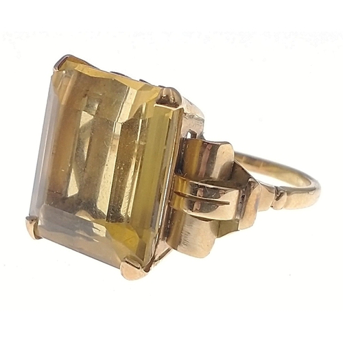 35 - A gold ring stamped 750 set with a large topaz 20 x 20mm approx.  Size O, gross weight 10.65g approx... 