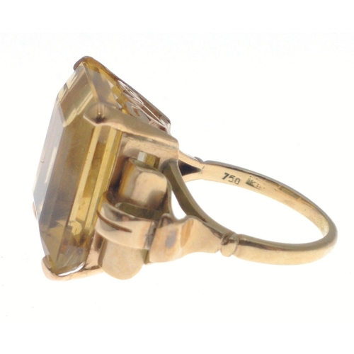 35 - A gold ring stamped 750 set with a large topaz 20 x 20mm approx.  Size O, gross weight 10.65g approx... 