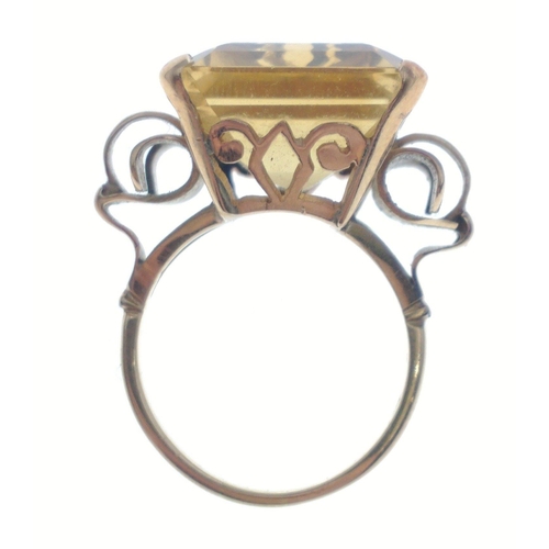 35 - A gold ring stamped 750 set with a large topaz 20 x 20mm approx.  Size O, gross weight 10.65g approx... 