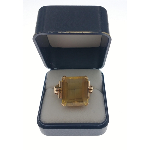 35 - A gold ring stamped 750 set with a large topaz 20 x 20mm approx.  Size O, gross weight 10.65g approx... 