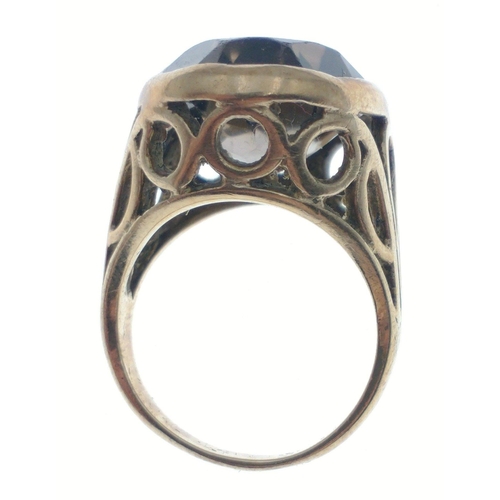 39 - A large chunky 9ct stamped gold ring set with Cairngorm style stone, with pierced shoulders, size N,... 