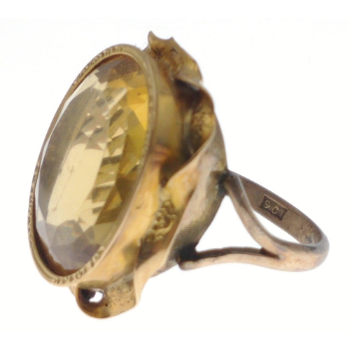 40 - A large 9ct stamped gold ring set with a multi-faceted topaz, size M/N, gross weight 6.52g approx#40... 