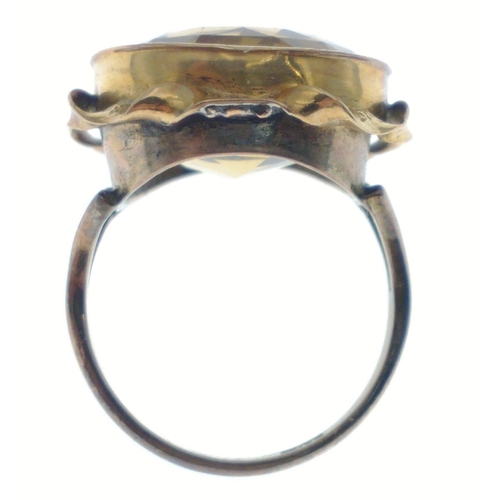 40 - A large 9ct stamped gold ring set with a multi-faceted topaz, size M/N, gross weight 6.52g approx#40... 