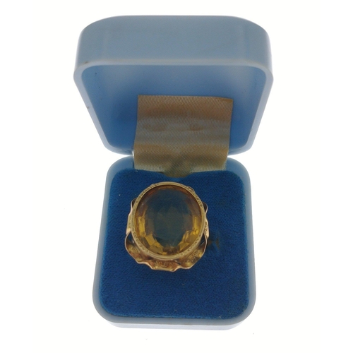 40 - A large 9ct stamped gold ring set with a multi-faceted topaz, size M/N, gross weight 6.52g approx#40... 