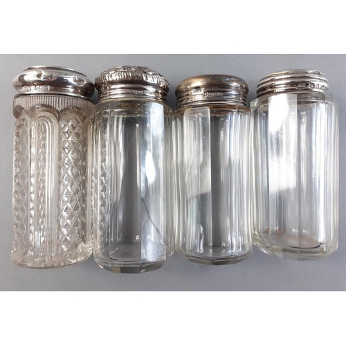 75 - A collection of four cut glass dressing table bottles, each with a silver collar, tallest 9cm approx... 