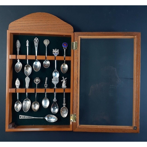 78 - A useful spoon collector's cabinet containing 8 silver marked spoons weight 90g approx and 5 others#... 