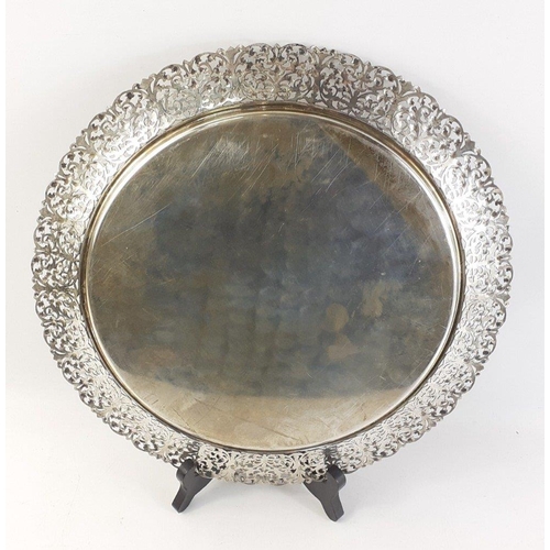 80 - A silver tray stamped 800, with pierced edges, 29cm diameter approx.  Weight 400g approx#79