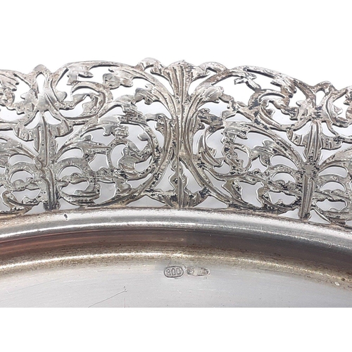 80 - A silver tray stamped 800, with pierced edges, 29cm diameter approx.  Weight 400g approx#79