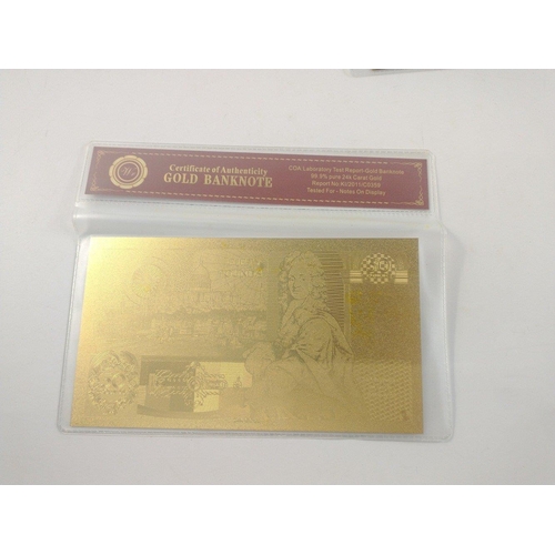 86 - A quantity of nicely produced gold banknotes in sealed packs. In excellent condition.#85