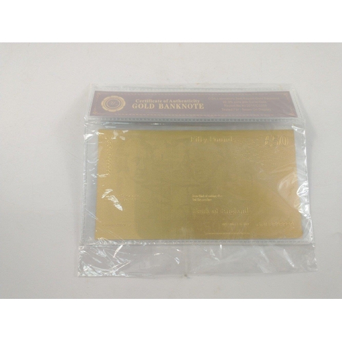 86 - A quantity of nicely produced gold banknotes in sealed packs. In excellent condition.#85