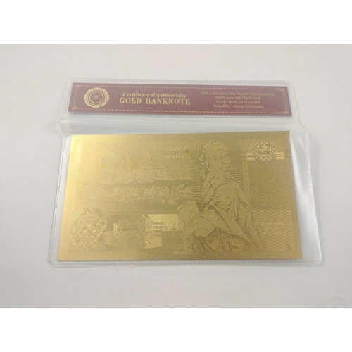 86 - A quantity of nicely produced gold banknotes in sealed packs. In excellent condition.#85