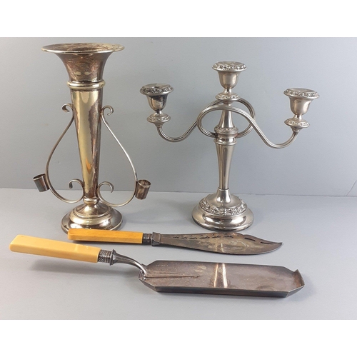 122 - A silver plate lot to include a vase 27cm tall, 3 branch candelabra, a 29cm pierced plate and others... 