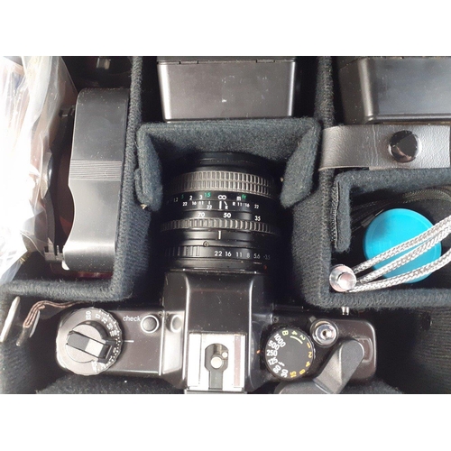 393 - A cased PRAKTICA BMS electronic camera body with PRAKTICA PB 3.5-4.5 / 35-70 lens. Good condition in... 