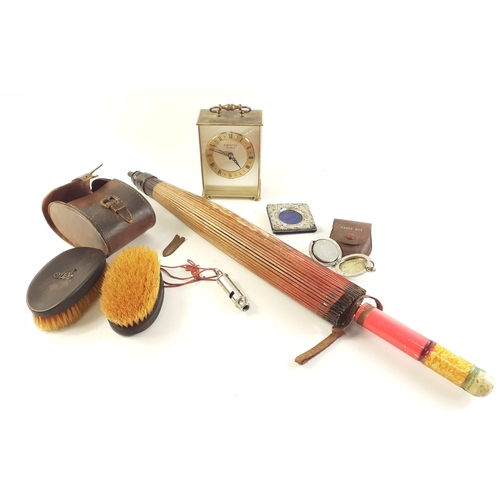 490 - A small collection of interesting items to include a quartz clock, brush set, whistle, picture frame... 