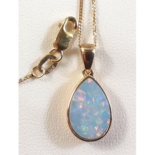 1 - A lovely 375 stamped teardrop shaped opal pendant (1cm long) on a 375 stamped chain approx 42cm long... 