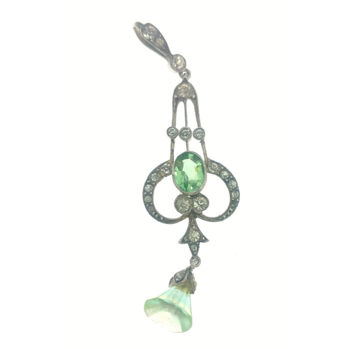 23 - An early 20th century white metal and two green stone pendant on a white metal chain with a vintage ... 