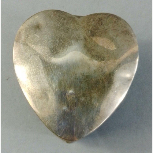 31 - A small silver hallmarked lined heart shaped trinket box.  Indistinct hallmark, 6cm length.  Gross w... 