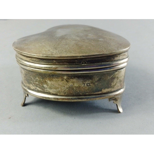 31 - A small silver hallmarked lined heart shaped trinket box.  Indistinct hallmark, 6cm length.  Gross w... 