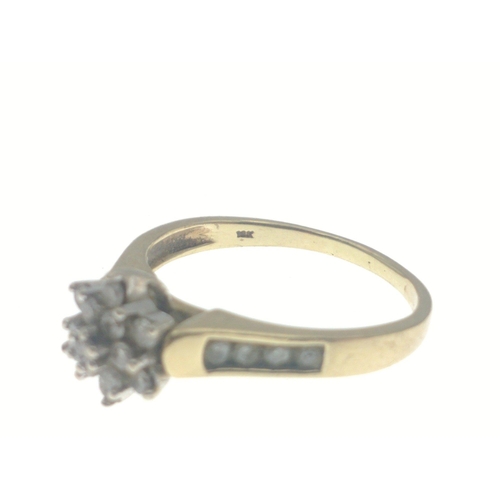 6 - A 10k stamped yellow gold diamonds (tested) set dress ring (size Q) in floral form with diamonds on ... 