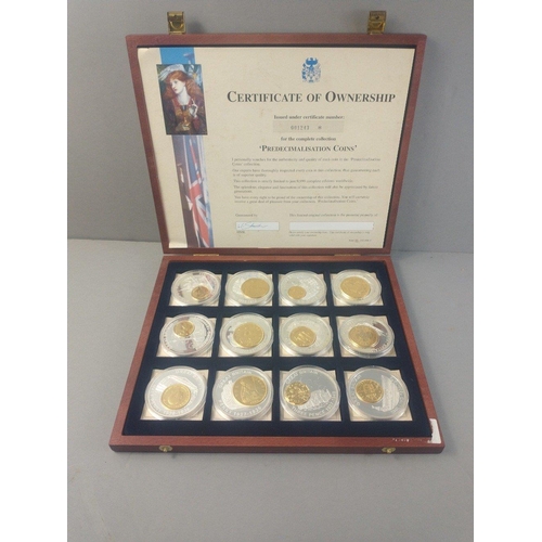 60 - Two cases of plated coins in cases to include pre-decimalisation coins and coins of Britannia.#60... 