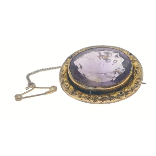 9 - A VICTORIAN 9ct stamped oval brooch with a large oval centred AMAZING AMETHYST - gross weight 6.72g ... 