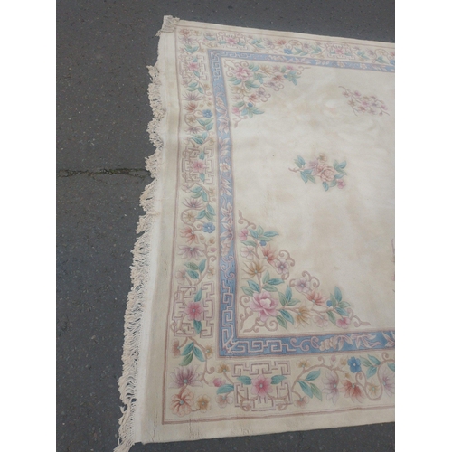 115 - A beautiful very large CHINESE wool cream base and floral patterned rug.  380x270cm approx
In lovely... 