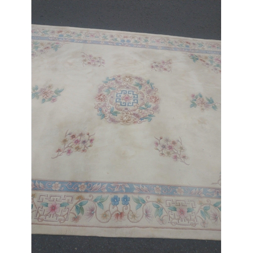 115 - A beautiful very large CHINESE wool cream base and floral patterned rug.  380x270cm approx
In lovely... 