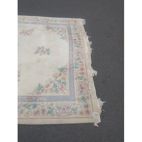 115 - A beautiful very large CHINESE wool cream base and floral patterned rug.  380x270cm approx
In lovely... 