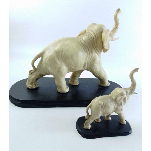 145 - Two stunning detailed elephants which would make a very attractive addition to your display cabinet.... 