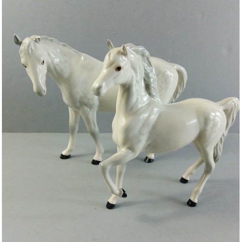 146 - Two ROYAL DOULTON horses. Lovely models each with damage to ear. The tallest 17cm approx.#40