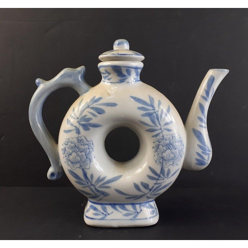 238 - Vintage blue and white donut shaped Chinese style teapot with lid. 17cm tall approx. No chips, crack... 