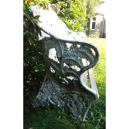 304 - A COALBROOKDALE cast iron garden bench. 190cm across and with wonderful peeling and cracking paint a... 