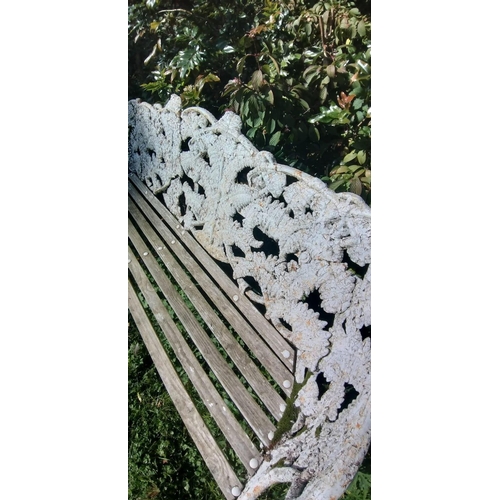 304 - A COALBROOKDALE cast iron garden bench. 190cm across and with wonderful peeling and cracking paint a... 