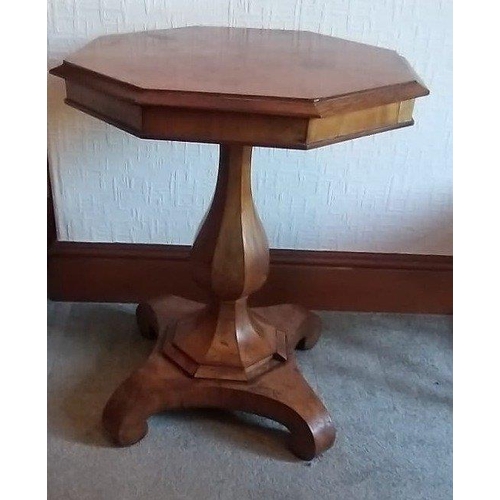 95 - A beautiful octagonal topped walnut pedestal table. The top with sectioned walnut veneer is supporte... 