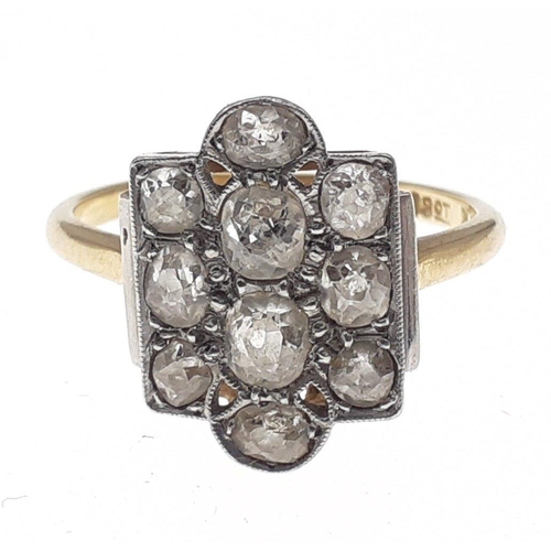 105 - An 18ct and platinum mounted ring with square setting, 10 diamonds to the top.  Size N, gross weight... 