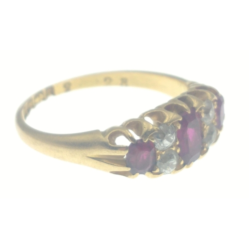 107 - An 18ct ruby and diamond gold ring, with 3 rubies and 4 diamonds (tested), size N, gross weight 3.6g... 