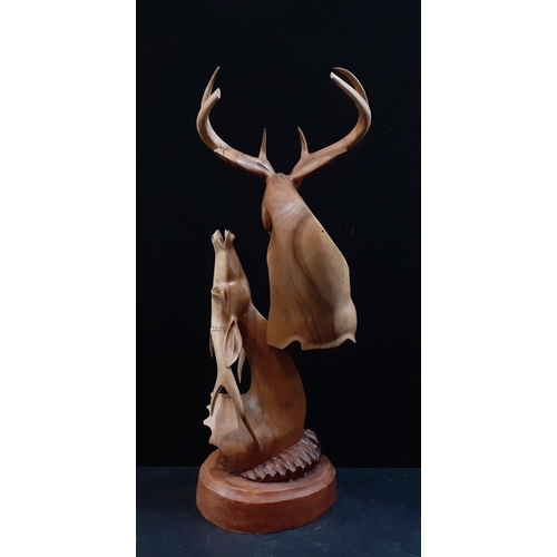 11 - A wonderful large carved wooden statue of two STAGS rutting.  Well sculpted and a very impressive pi... 