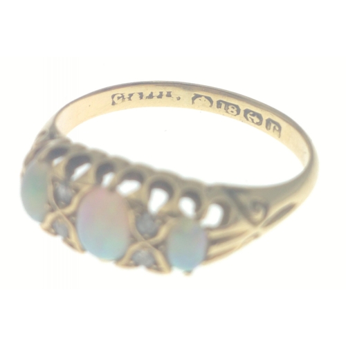 111 - An 18ct gold ring with opal and 4 diamonds (tested).  Three lovely opals with no cracks, size O, gro... 