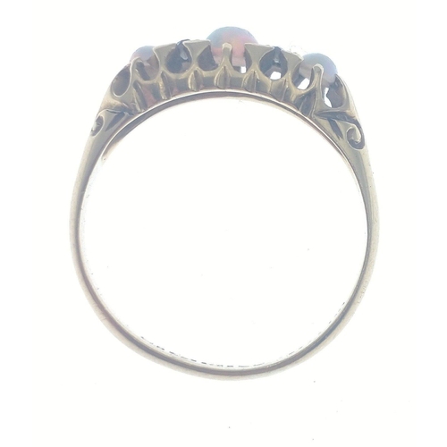 111 - An 18ct gold ring with opal and 4 diamonds (tested).  Three lovely opals with no cracks, size O, gro... 