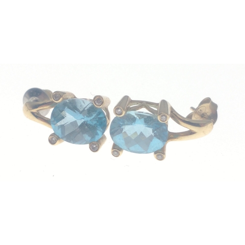 112 - A14K stamped diamond (tested) and aquamarine earrings 8mm in length, gross weight 4g approx#113